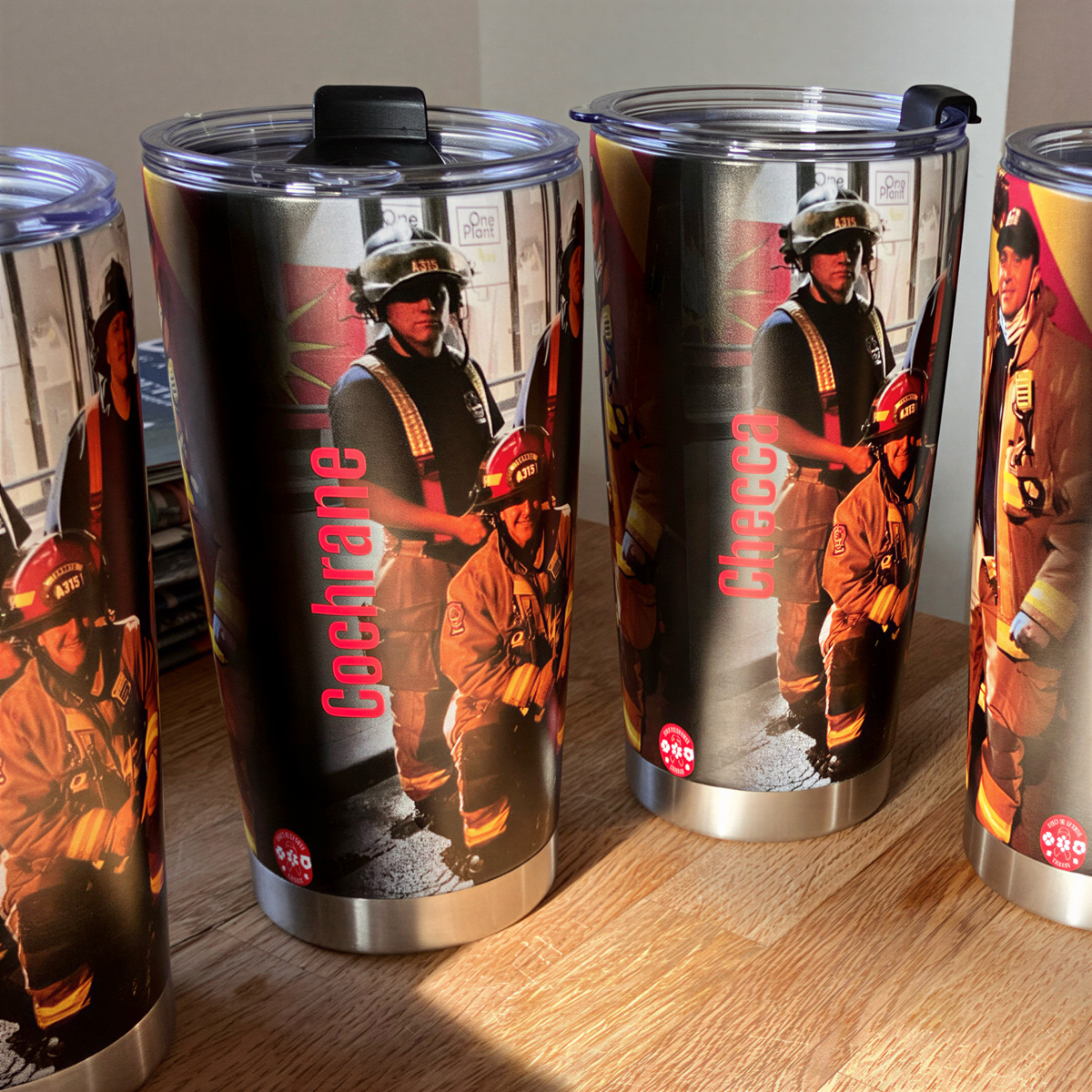 a collection of cups with firefighter images on them.